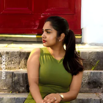 Divya Abraham green sleeveless bodycon dress