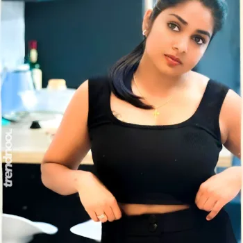 Divya Abraham green sleeveless bodycon dress