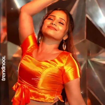 Krishna Shilpa orange satin crop top