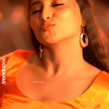 Krishna Shilpa orange satin crop top
