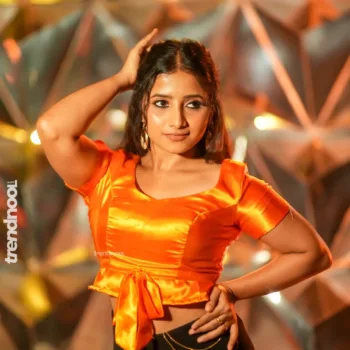 Krishna Shilpa orange satin crop top