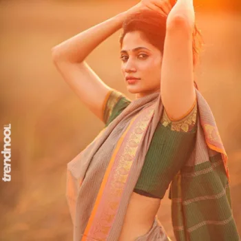 Losliya Mariyanesan green striped saree
