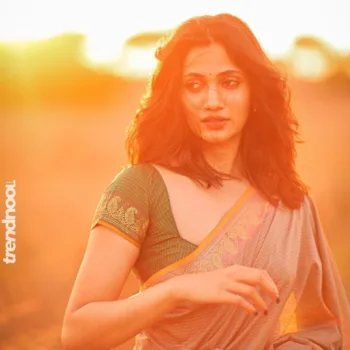 Losliya Mariyanesan green striped saree