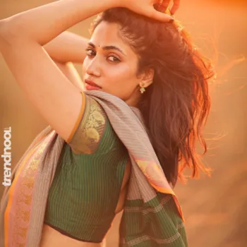 Losliya Mariyanesan green striped saree