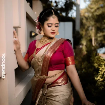 Remonisha Uthayakumar gold saree maroon blouse