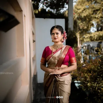 Remonisha Uthayakumar gold saree maroon blouse