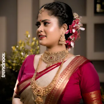 Remonisha Uthayakumar gold saree maroon blouse