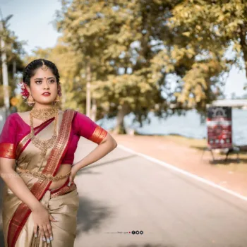 Remonisha Uthayakumar gold saree maroon blouse