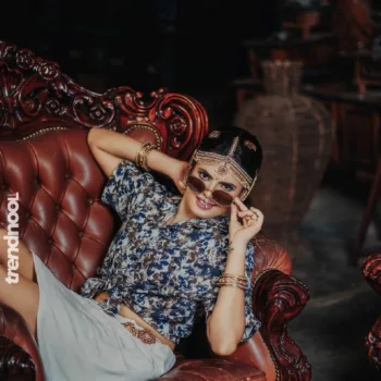 Poorvika Rasasingam floral shirt and white skirt