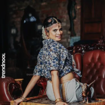Poorvika Rasasingam floral shirt and white skirt