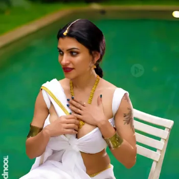 Resmi R Nair white saree