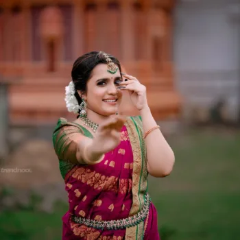 Sivakumar Nilaxshi magenta bridal saree