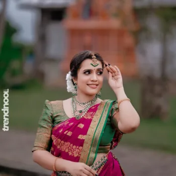 Sivakumar Nilaxshi magenta bridal saree