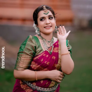 Sivakumar Nilaxshi magenta bridal saree