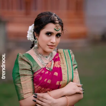 Sivakumar Nilaxshi magenta bridal saree