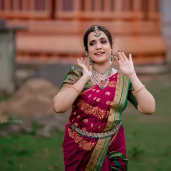 Sivakumar Nilaxshi magenta bridal saree