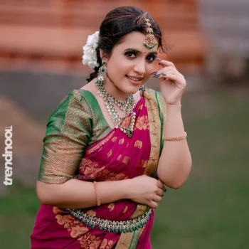 Sivakumar Nilaxshi magenta bridal saree