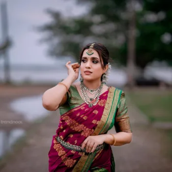Sivakumar Nilaxshi magenta bridal saree