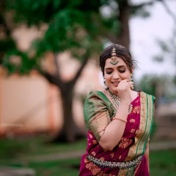Sivakumar Nilaxshi magenta bridal saree