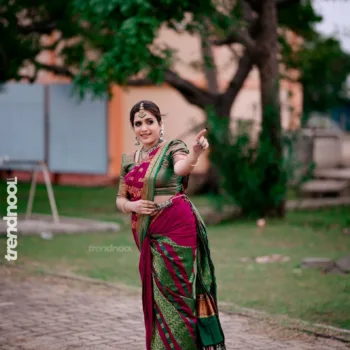 Sivakumar Nilaxshi magenta bridal saree