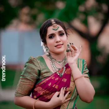 Sivakumar Nilaxshi magenta bridal saree