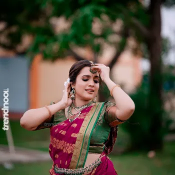 Sivakumar Nilaxshi magenta bridal saree