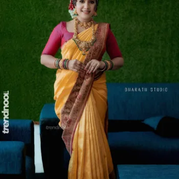 Sivakumar Nilaxshi yellow bridal saree