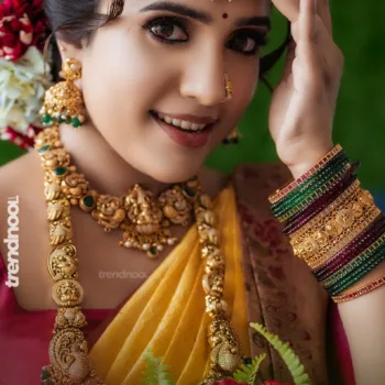 Sivakumar Nilaxshi yellow bridal saree