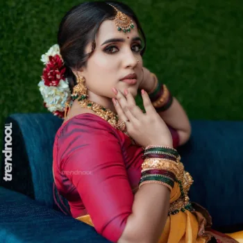 Sivakumar Nilaxshi yellow bridal saree