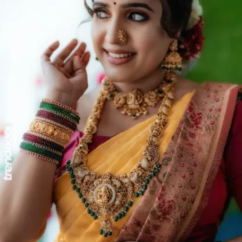 Sivakumar Nilaxshi yellow bridal saree