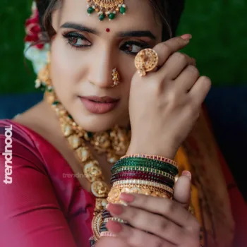 Sivakumar Nilaxshi yellow bridal saree