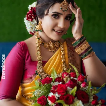 Sivakumar Nilaxshi yellow bridal saree
