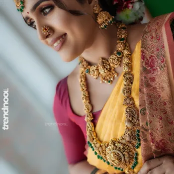Sivakumar Nilaxshi yellow bridal saree