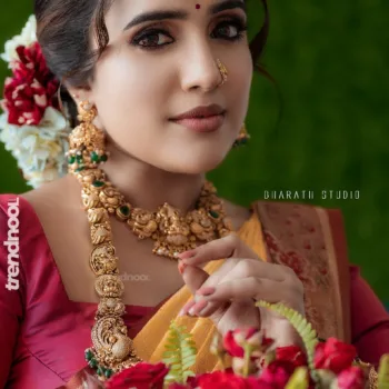Sivakumar Nilaxshi yellow bridal saree
