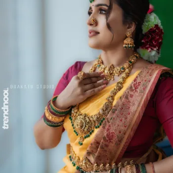 Sivakumar Nilaxshi yellow bridal saree