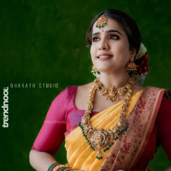 Sivakumar Nilaxshi yellow bridal saree