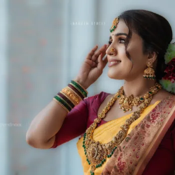 Sivakumar Nilaxshi yellow bridal saree
