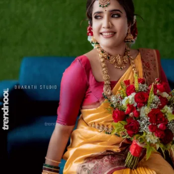 Sivakumar Nilaxshi yellow bridal saree