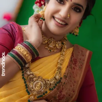 Sivakumar Nilaxshi yellow bridal saree