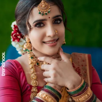 Sivakumar Nilaxshi yellow bridal saree