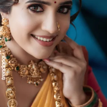 Sivakumar Nilaxshi yellow bridal saree