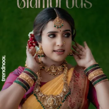 Sivakumar Nilaxshi yellow bridal saree